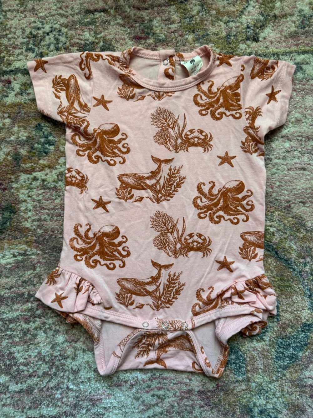 Kate Quinn ruffle leg onesie